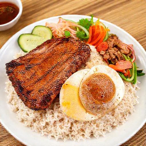 Cơm Tấm Sườn Bì Chả (Classic Broken Rice with Grilled Pork Chop, Shredded Pork Skin, and Steamed Egg Meatloaf)
