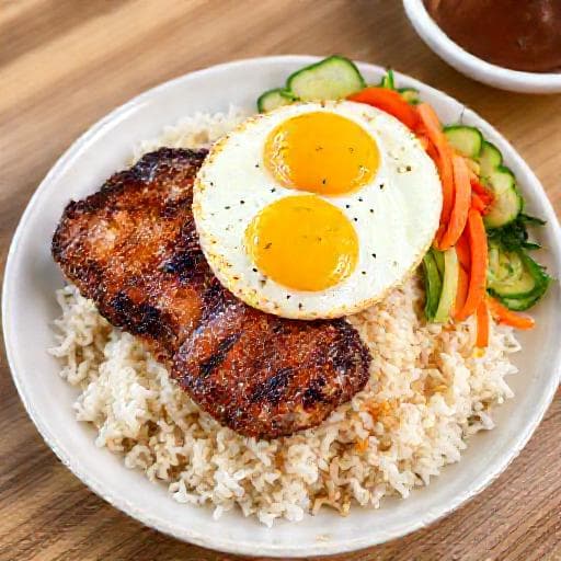 Cơm Tấm Sườn Chả Trứng (Broken Rice with Grilled Pork Chop, Steamed Egg Meatloaf, and Fried Egg)