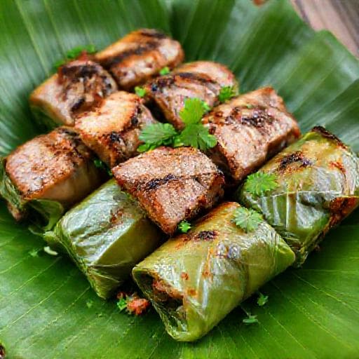 Thịt Heo Nướng Riềng Mẻ Cuốn Lá Lốt (Grilled Pork with Galangal and Fermented Rice Wrapped in Betel Leaves)