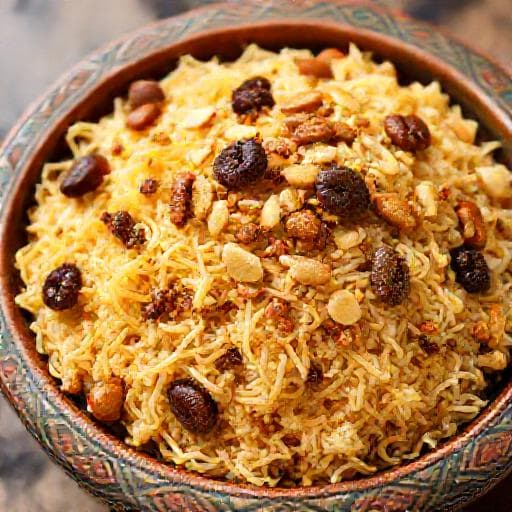 أرز بالشعيرية مع المكسرات والزبيب (لمسة شرقية)