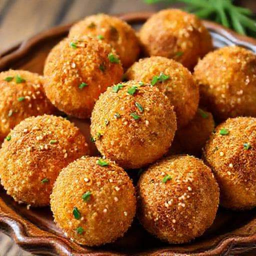 Сирні кульки з зеленню та кунжутом