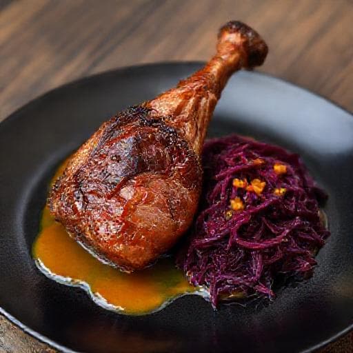 Kacsa confit párolt lilakáposztával és narancsmártással